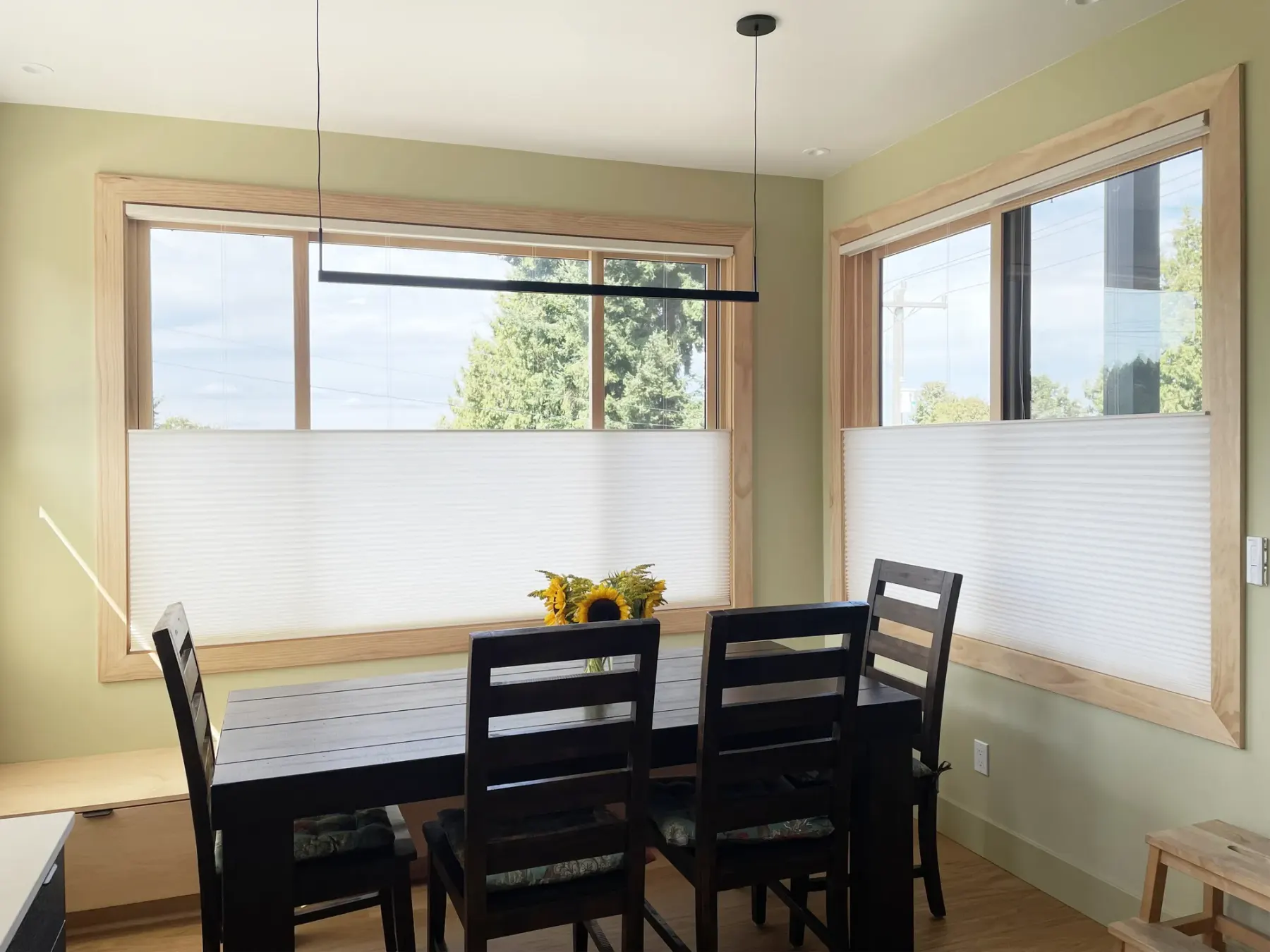 Motorized honeycomb shade with top-down/bottom-up in a West Seattle dining room