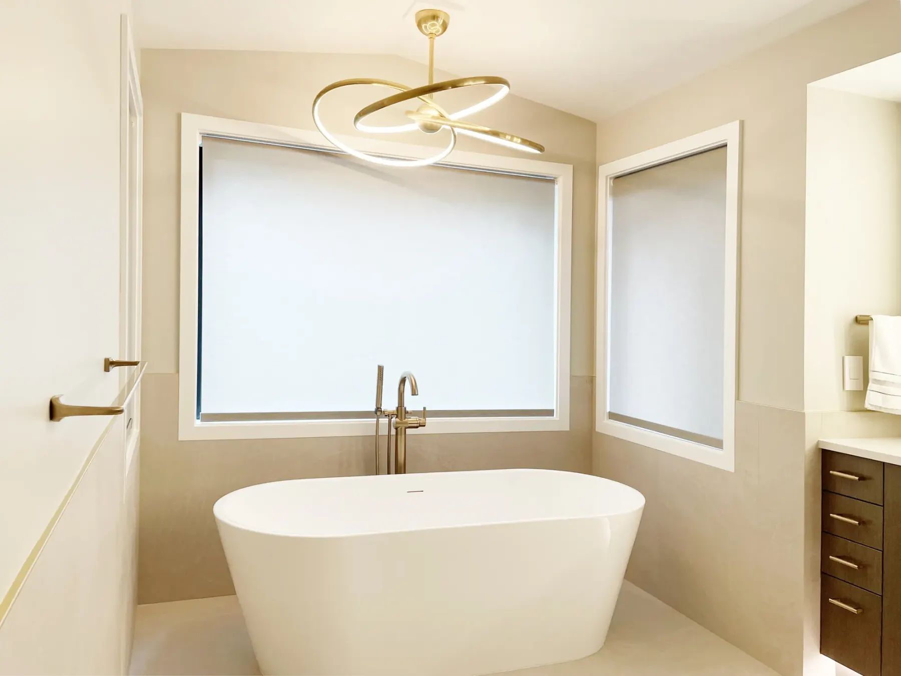 Motorized roller shades providing privacy in a remodeled Redmond primary bathroom