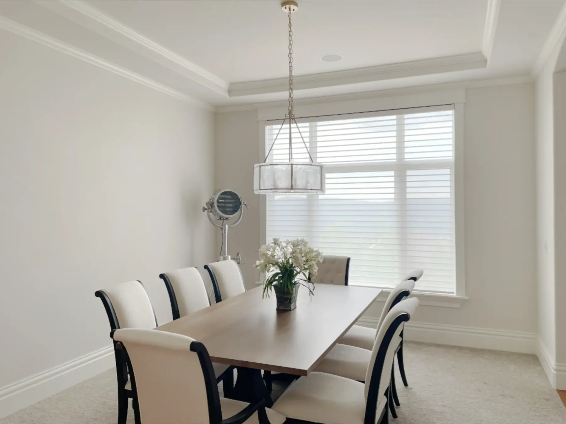 Motorized Silhouette sheer shades preserving mountain views in an Issaquah dining room