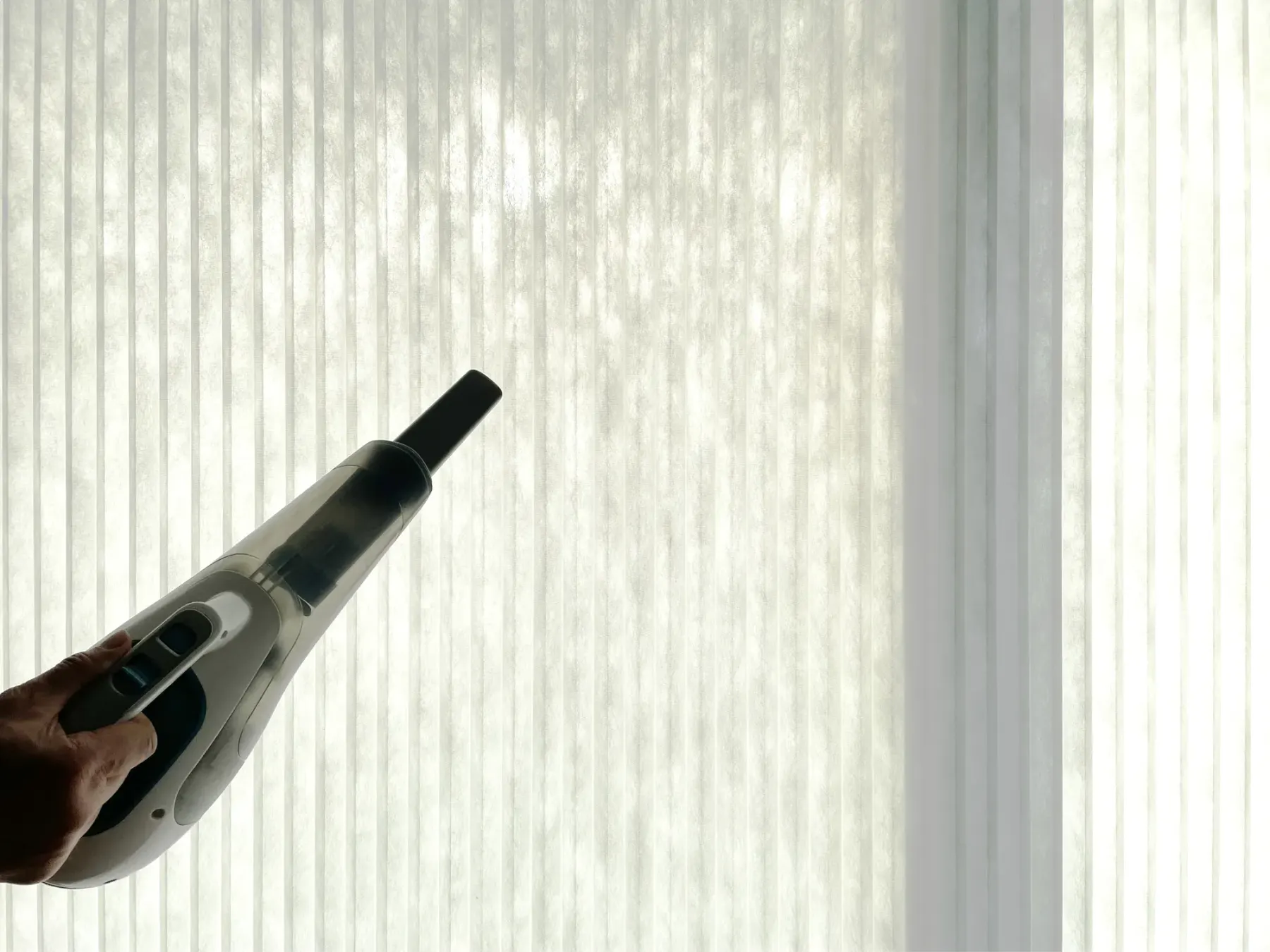 Low-suction vacuum cleaning dust from a honeycomb shade in a Bellevue home
