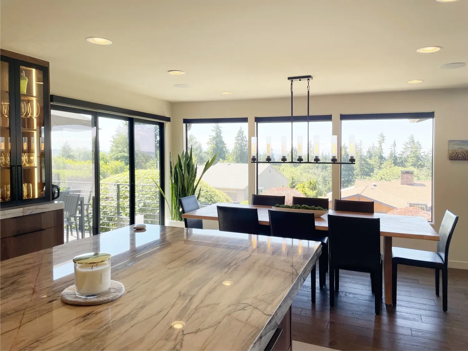 Motorized solar shades raised for dining room in Bellevue