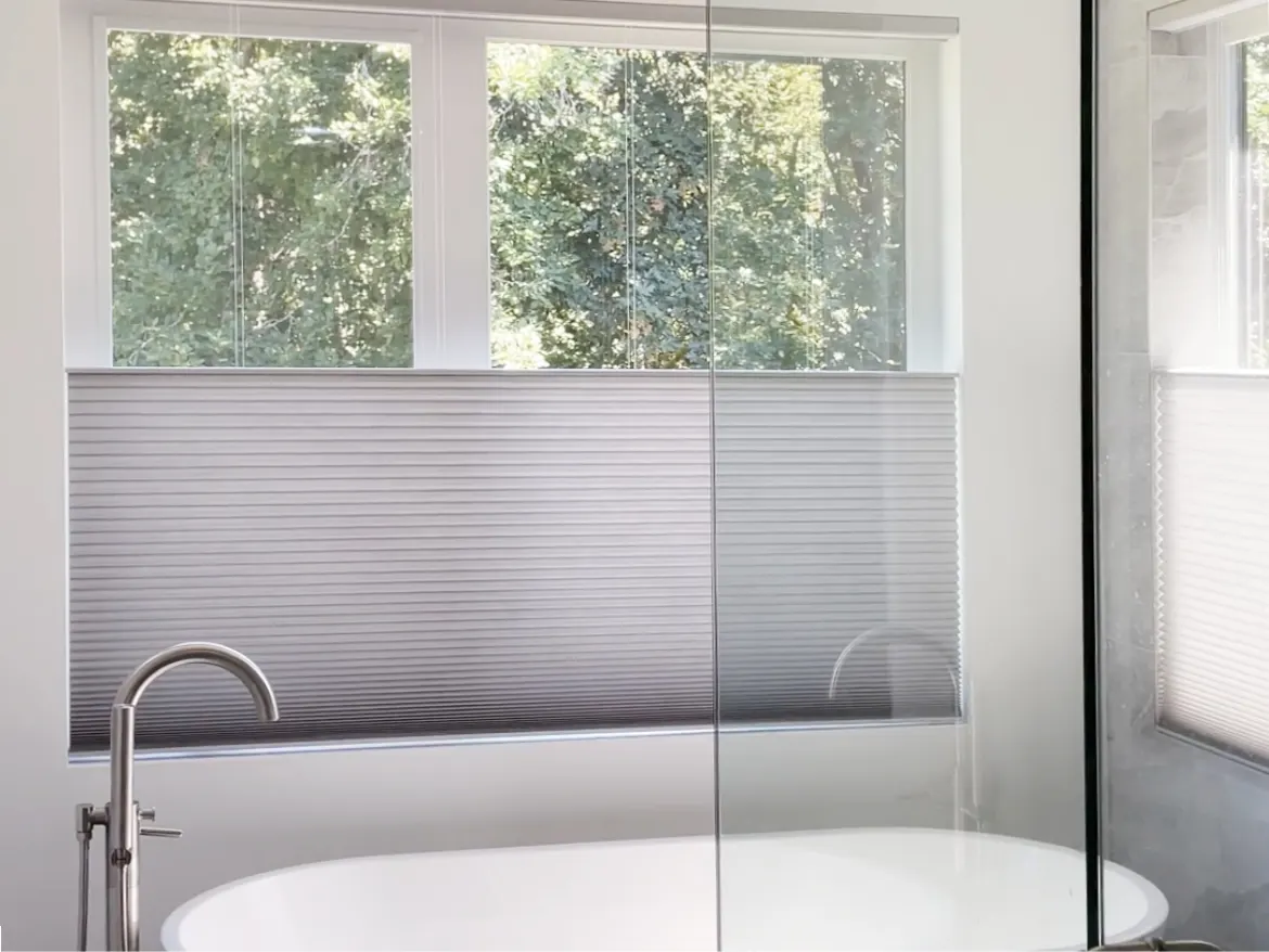Motorized top-down/bottom-up Duette honeycomb shades in an Issaquah primary bathroom