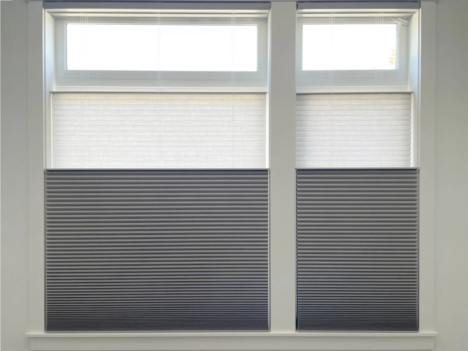 Combined light-filtering and room-darkening Duette honeycomb shades in an Issaquah home