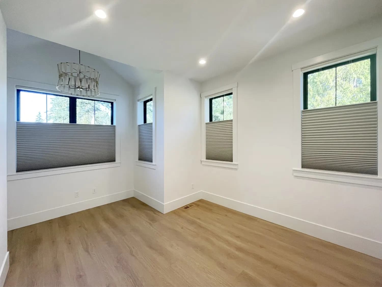 Motorized blackout honeycomb shades installed in a Shoreline bedroom