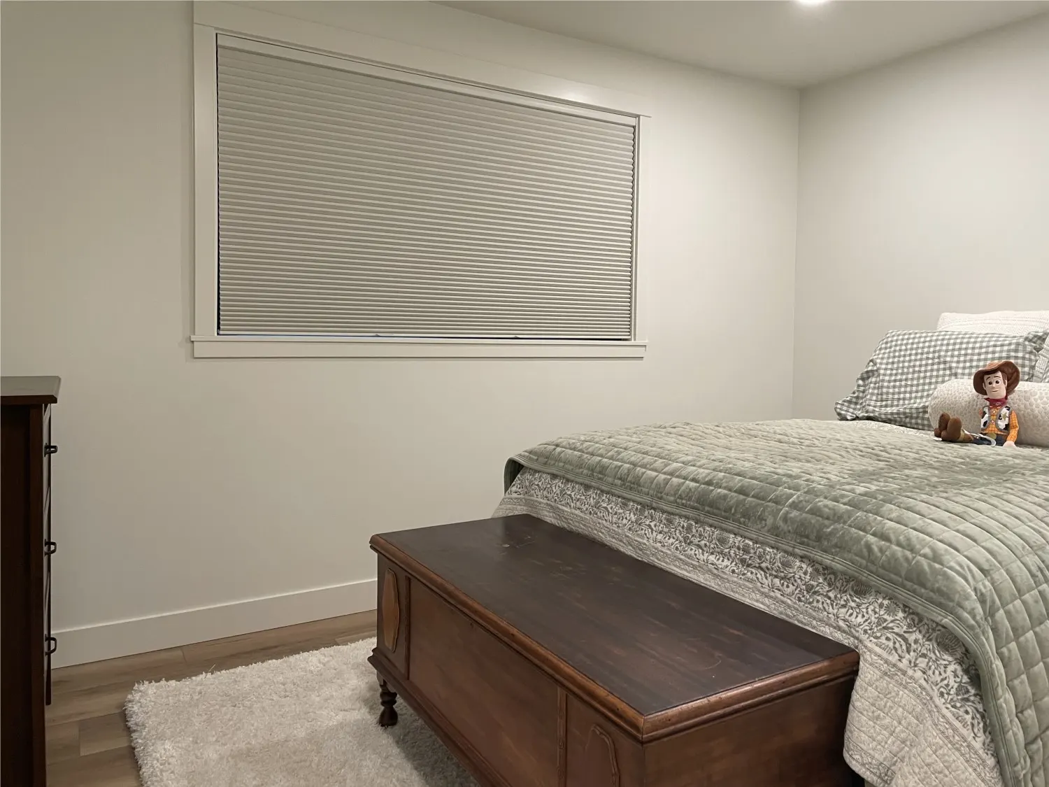 Blackout honeycomb shades providing room darkening in a Woodinville guest bedroom