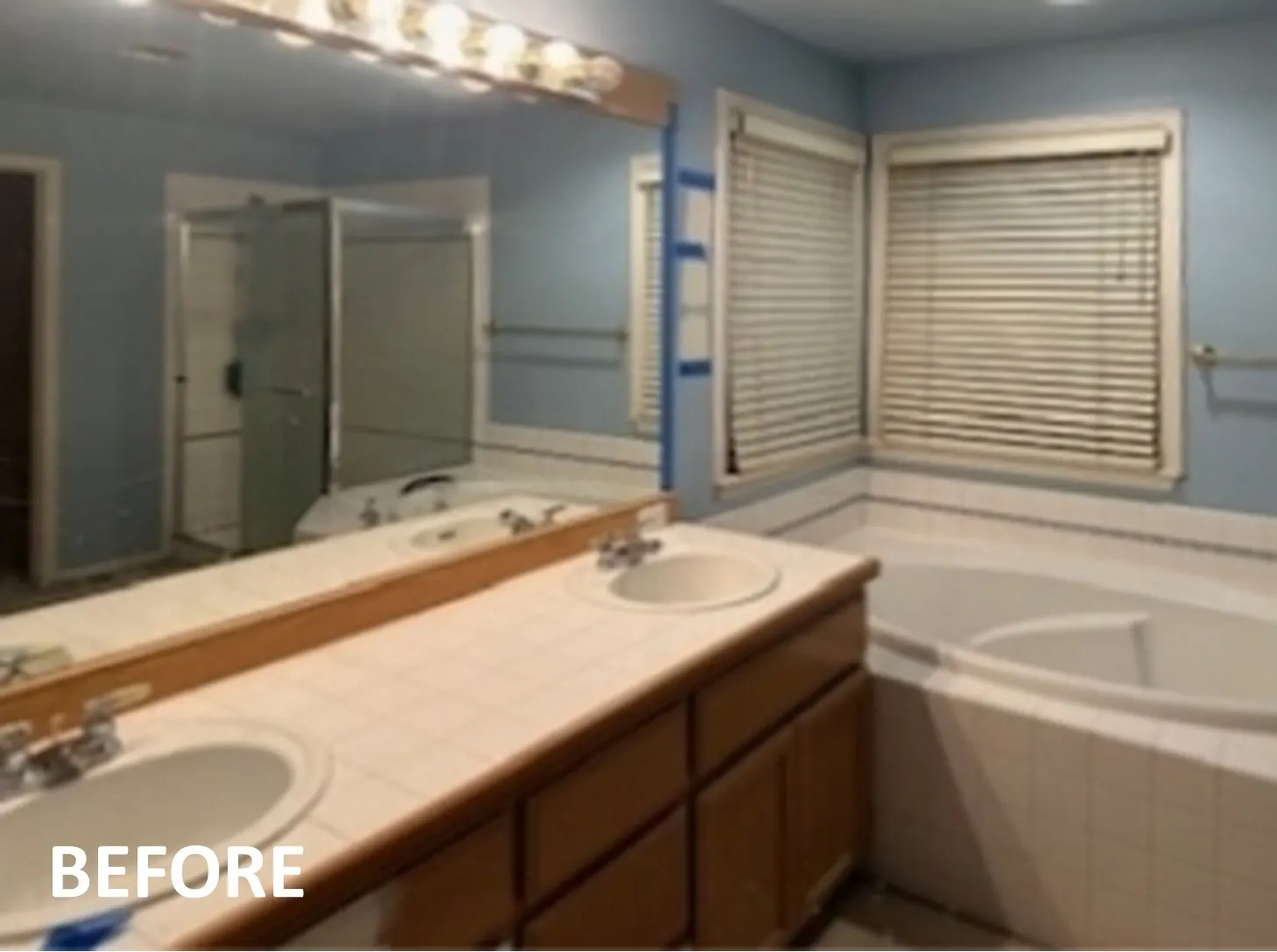 Existing Blinds Before Honeycomb Shades were Installed in a Primary Bathroom in Sammamish 2