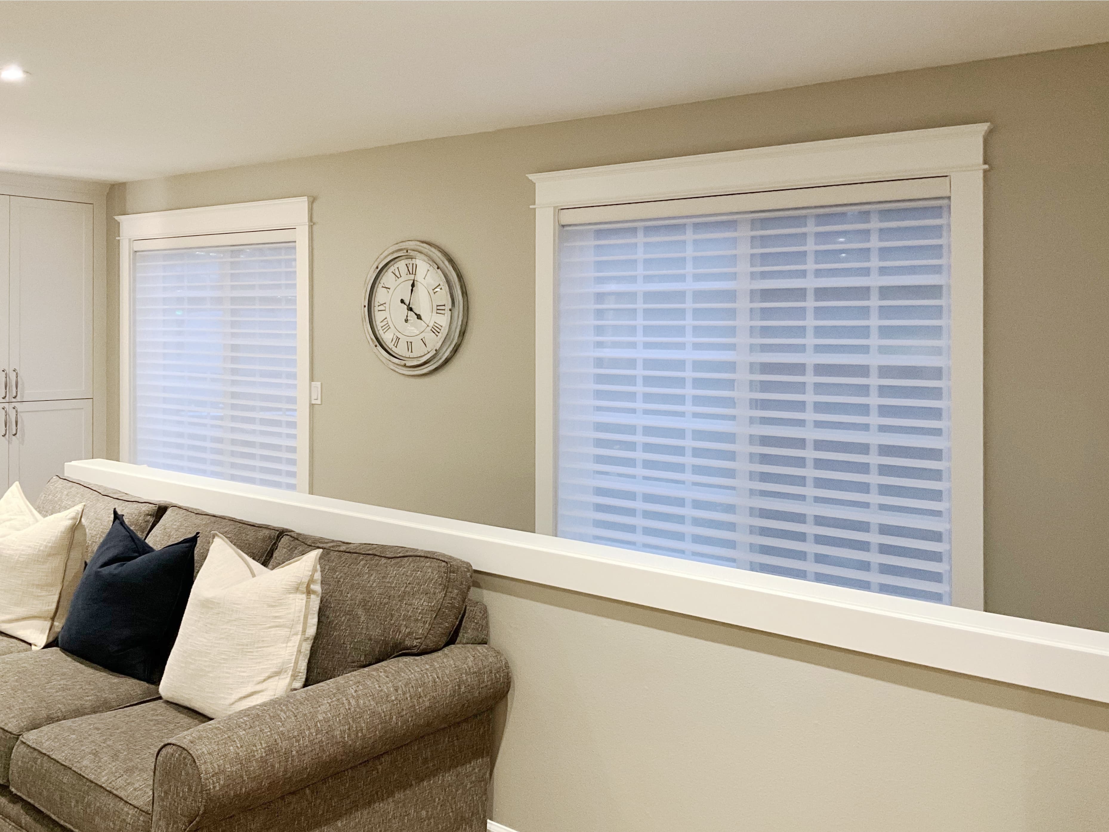 Motorized Hunter Douglas Silhouette® shades on stairway windows in a Woodinville home