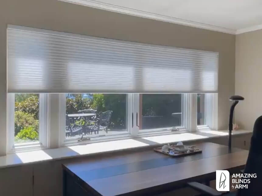Motorized honeycomb shades for heat and glare control in a Seattle Magnolia home office.