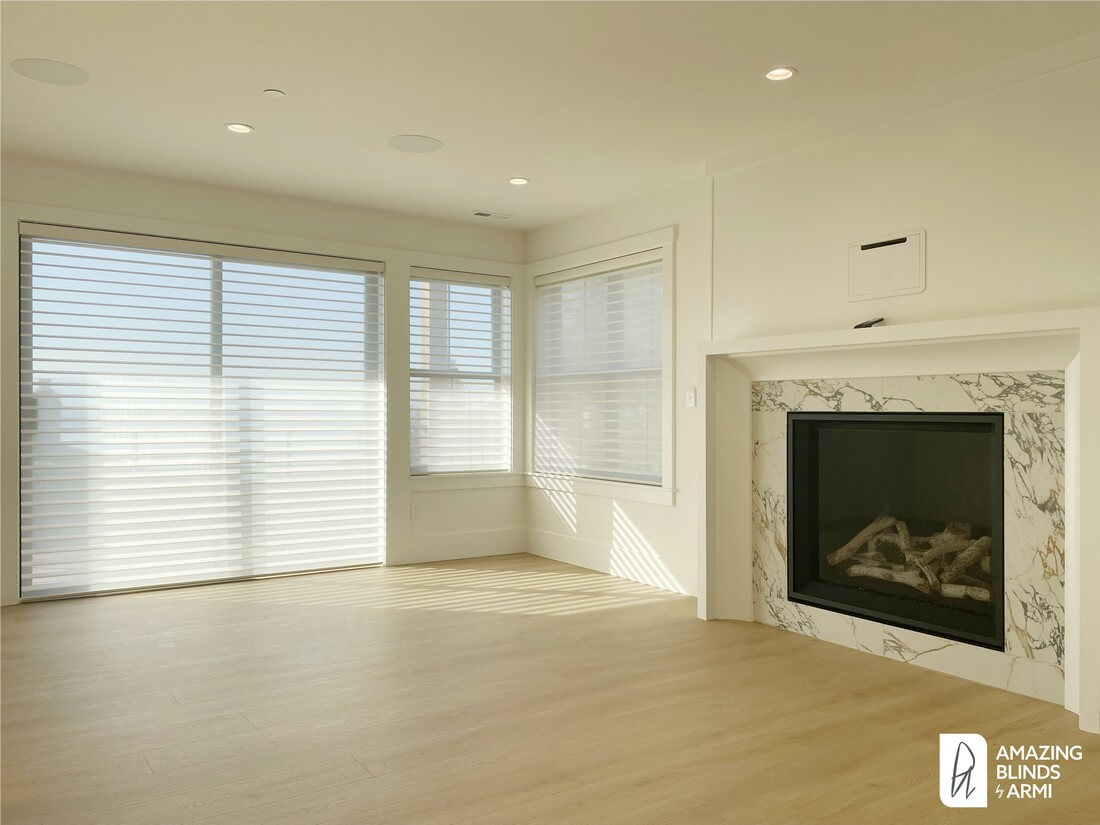 Motorized Hunter Douglas Silhouette shades on sliding doors and adjacent windows in a Shoreline WA home remodel.