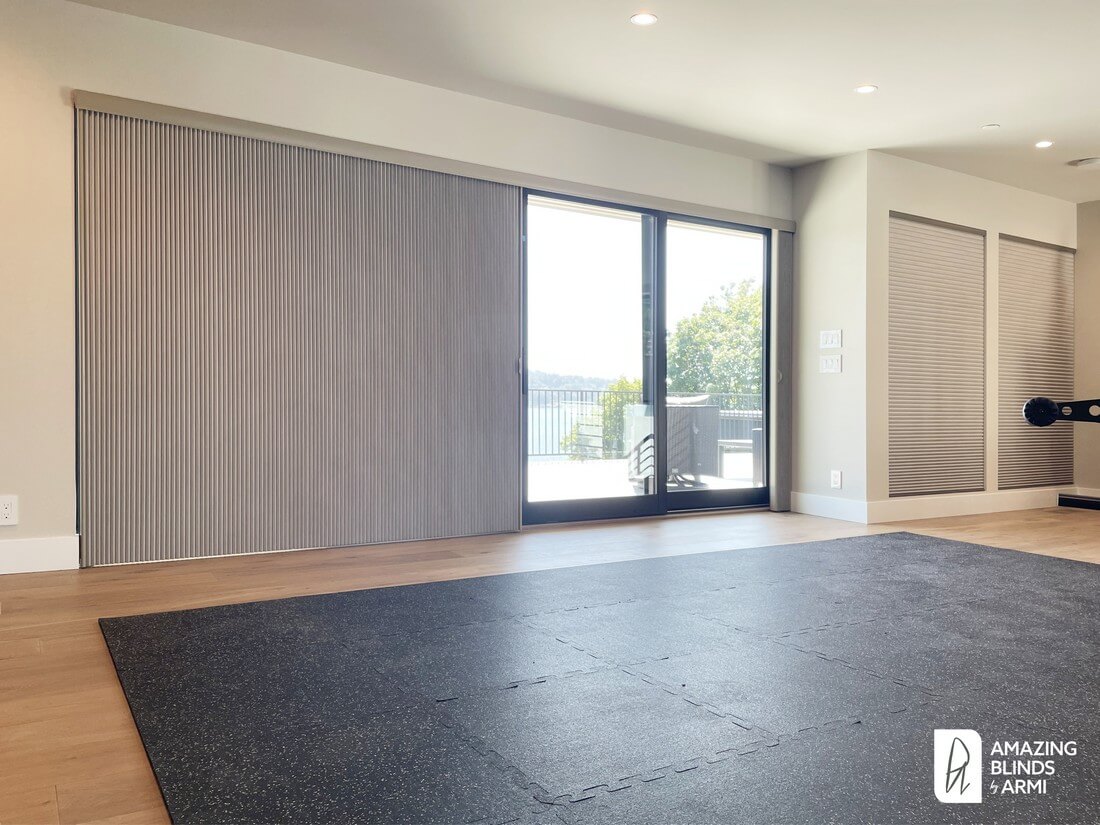 Vertical honeycomb shades for a large sliding glass door and motorized top-down/bottom-up honeycomb shades for the windows in a Mercer Island WA home